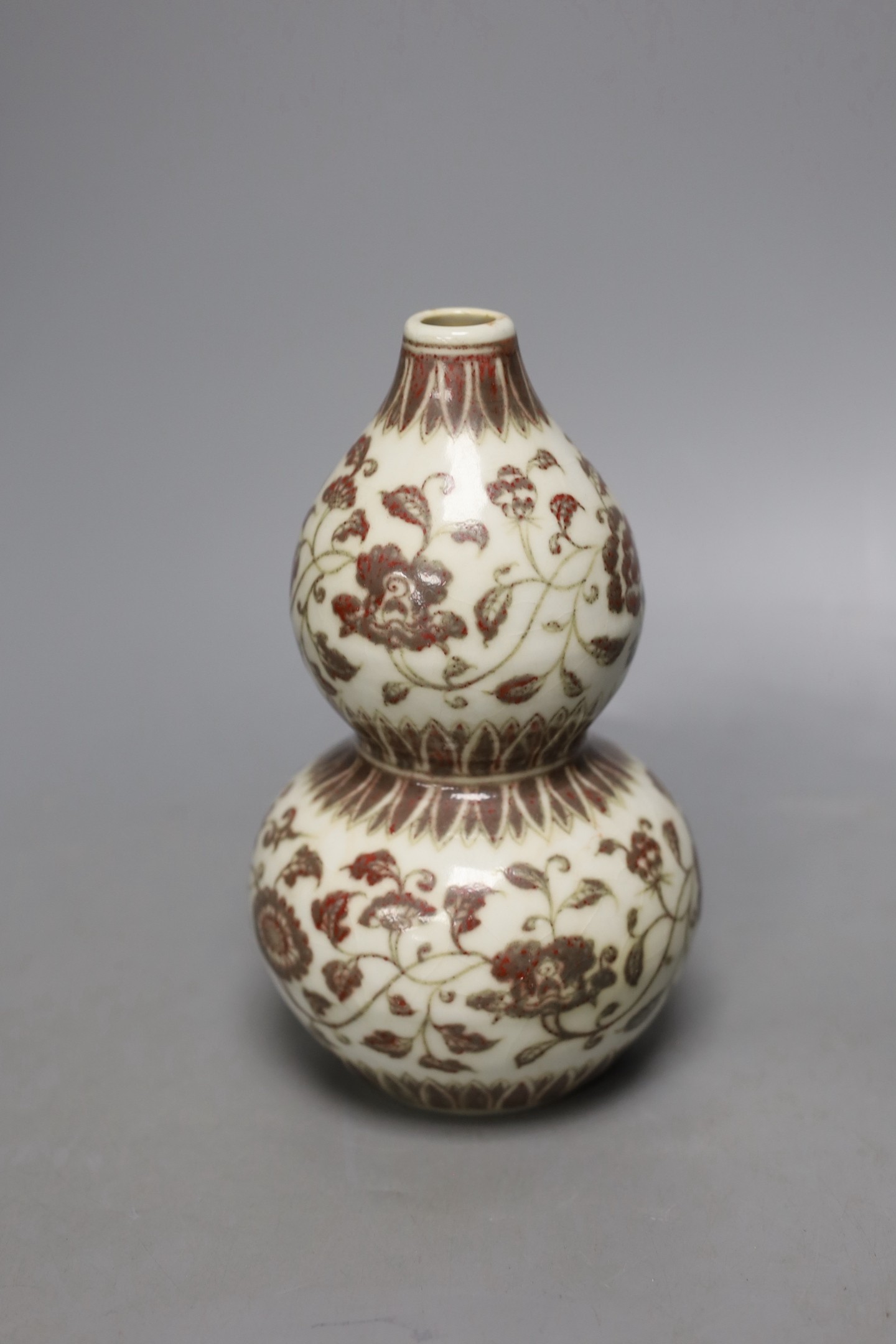 A Chinese underglaze copper red double gourd vase, 18cm high.